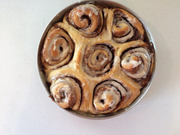 cinnamon rolls with icing in pan