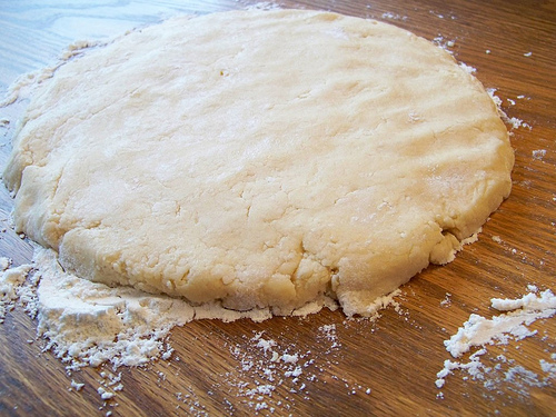 flattening out scone dough on table