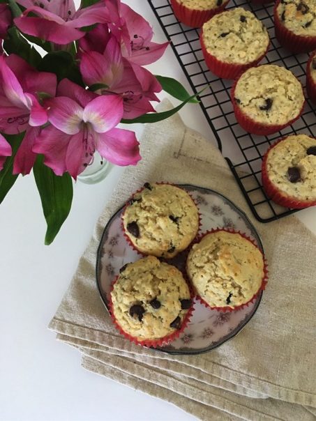 Serving Oatmeal Chocolate Chip Muffins on small plate with flowers