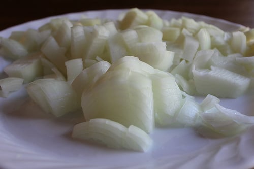 cut up onions on white plate