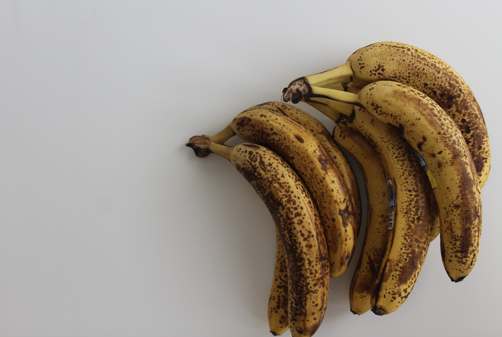 ripe bananas on white counter