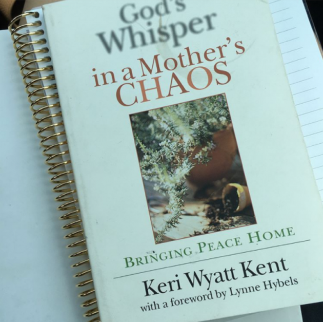 close-up photo of God's Whisper in a Mother's Chaos book