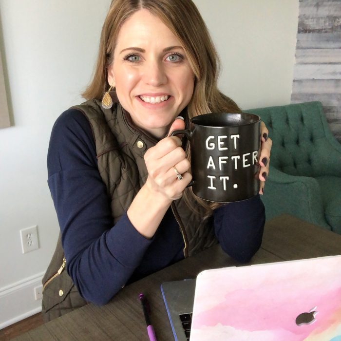 Crystal Paine holding Get After It coffee mug