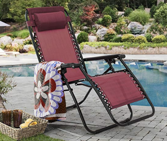 red zero gravity chair by the pool