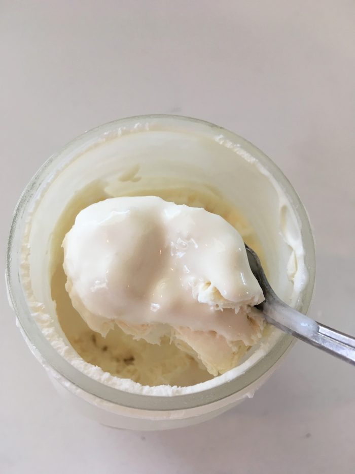 ice cream on a spoon from a mason jar