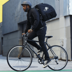 Postmates Driver on Bicycle