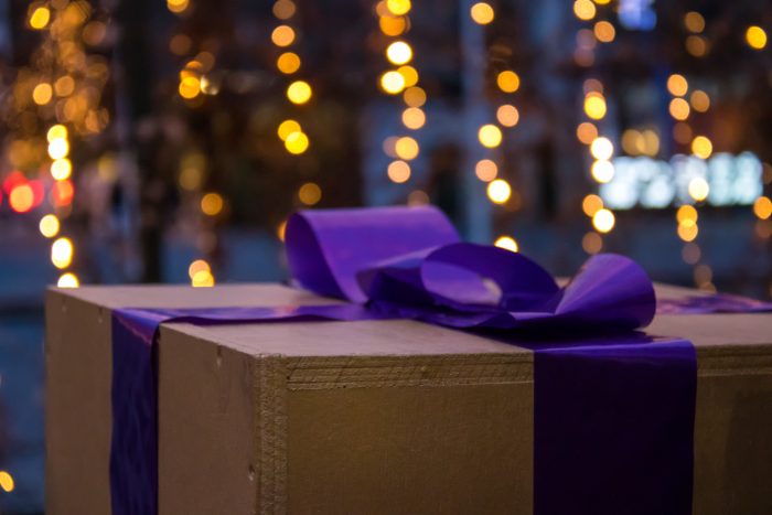 Gift box with purple bow