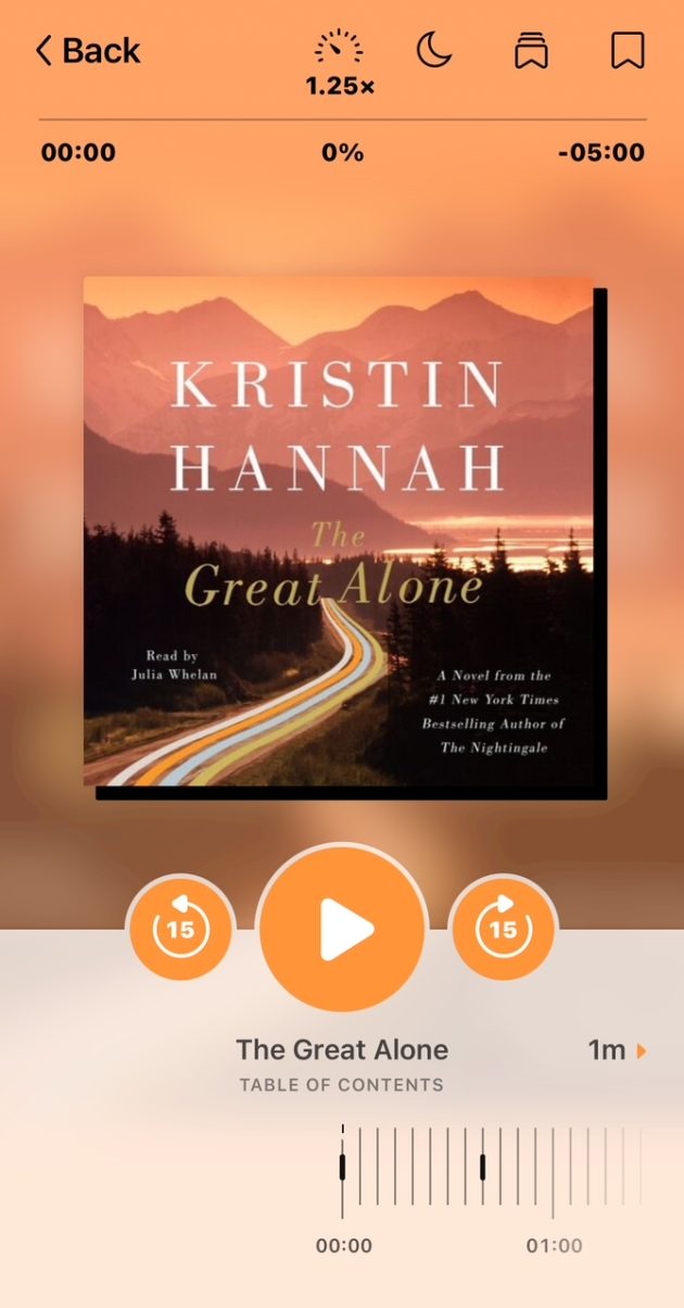 Audiobook player screen showing Kristin Hannah’s “The Great Alone” with mountain scenery and a winding road on the cover.