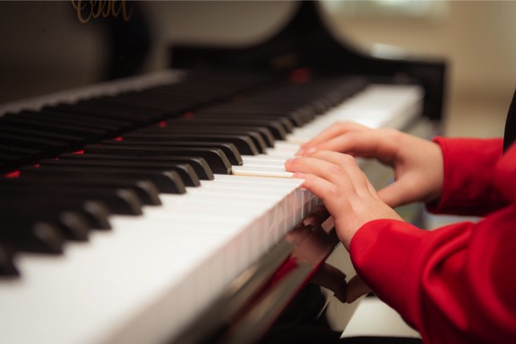 little kid hands playing piano