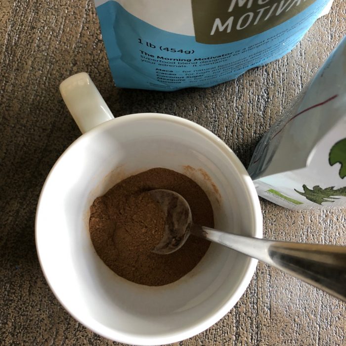 stirring coffee alternatives together in a mug
