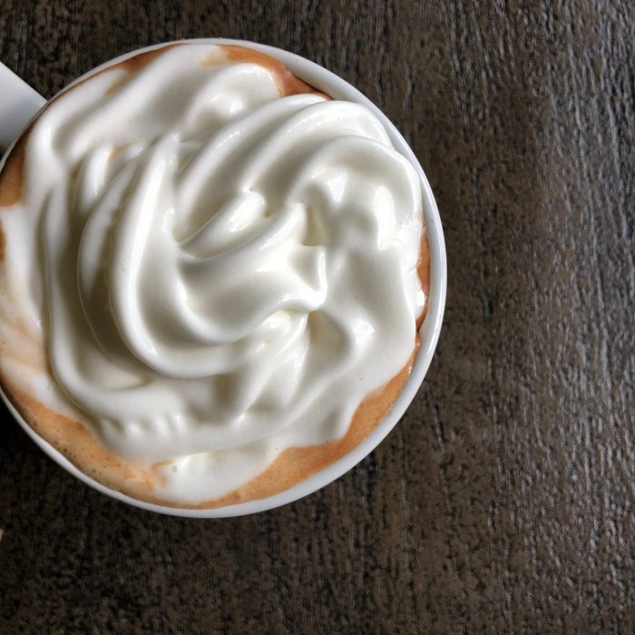 mug of hot beverage with whipped cream on top