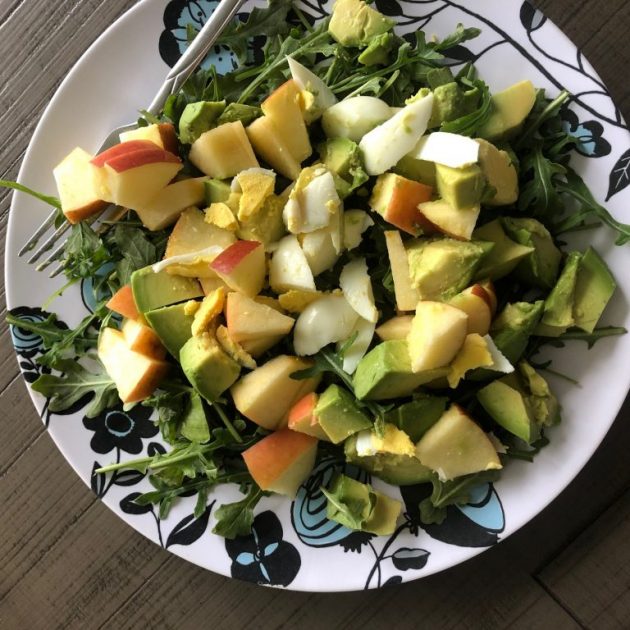 huge salad with apples and avocado