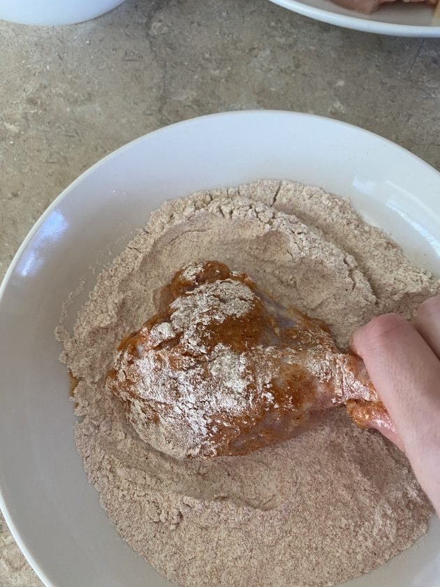 dip chicken pieces into flour mixture