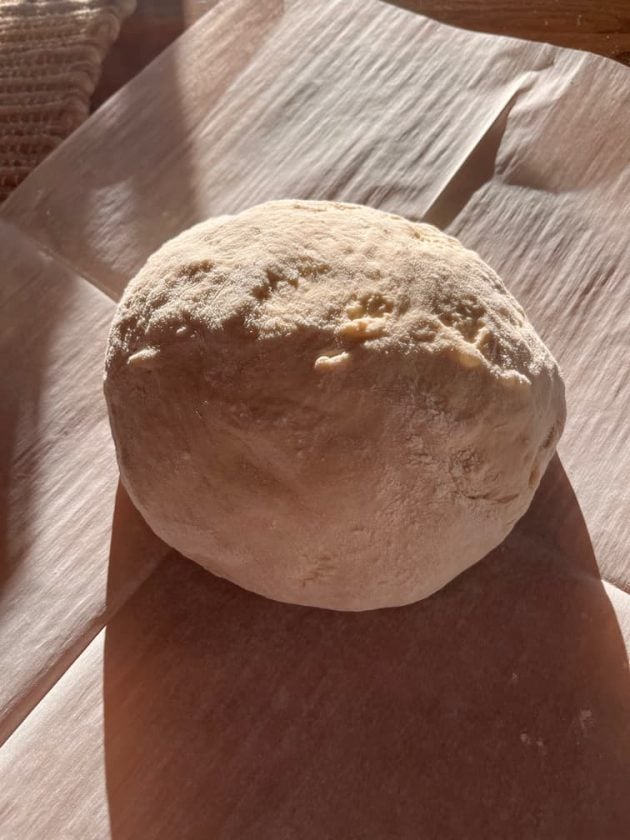 ball of dough on parchment paper
