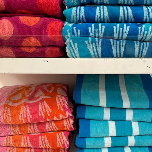 The Big One Beach Towels on shelves