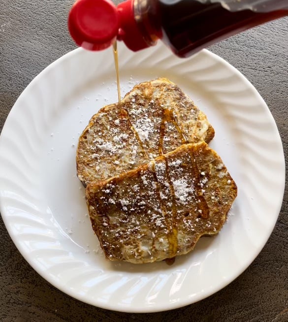 drizzling syrup on. French toast