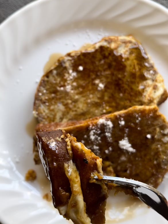 Close-up of French toast on fork