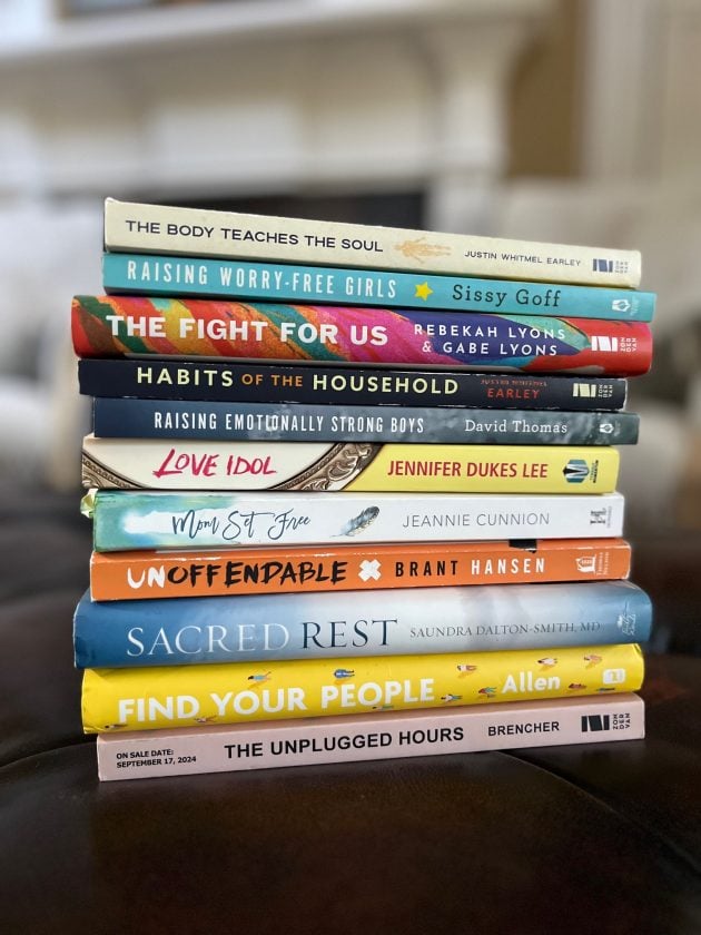 Stack of recommended non-fiction books including "The Body Teaches the Soul," "Raising Worry-Free Girls," "The Fight for Us," "Habits of the Household," "Raising Emotionally Strong Boys," "Love Idol," "Mom Set Free," "Unoffendable," "Sacred Rest," "Find Your People," and "The Unplugged Hours." Collection of some of the best non-fiction books of all time for personal growth, faith, relationships, and parenting.