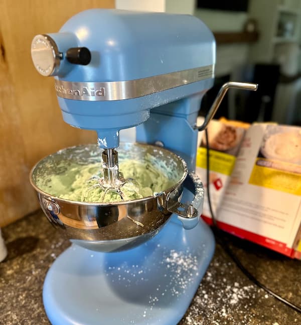 smaller bowl with frosting on kitchenaid mixer